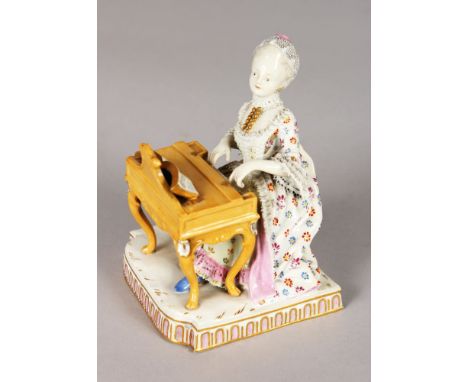 A 19TH CENTURY MEISSEN GROUP OF THE CENSORS, a lady sitting playing a spinet. Cross swords mark in blue.  5ins high.