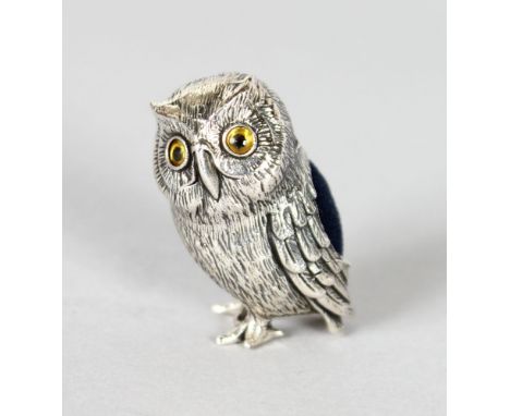 A MINIATURE SILVER OWL PIN CUSHION.