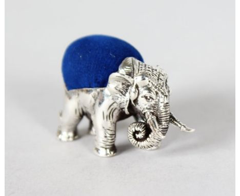 A MINIATURE SILVER ELEPHANT PIN CUSHION.