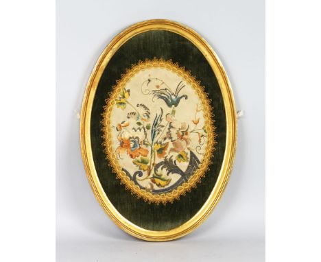 A GOOD OVAL TAPESTRY, framed and glazed, in a gilt frame. 22ins x 15ins.