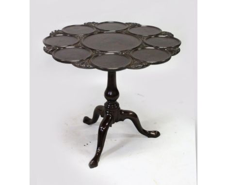 A GEORGE III DESIGN MAHOGANY SUPPER TABLE, the carved, shaped top with dish supports, on a "bird cage" tripod support  with p