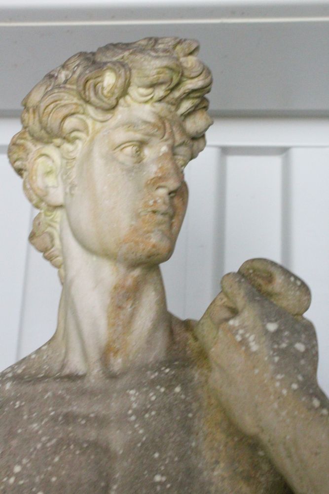 A GOOD LIFE SIZE STATUE OF DAVID, in classical pose on a pedestal base