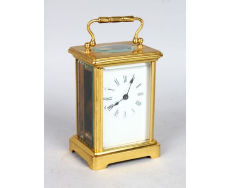 A BRASS CARRIAGE CLOCK TIMEPIECE.  5ins high.