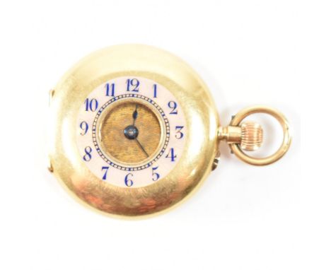 A hallmarked 18ct gold half hunter fob pocket watch. The watch having blue enamelled arabic numerals to the window, with an e