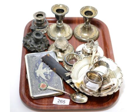 A group of silver items including candlesticks, inkwell, vesta, napkin rings, etc