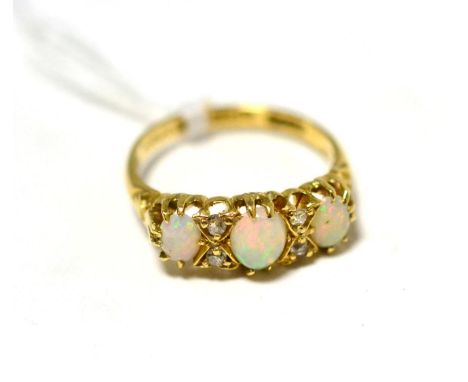 An 18ct gold diamond and opal ring 