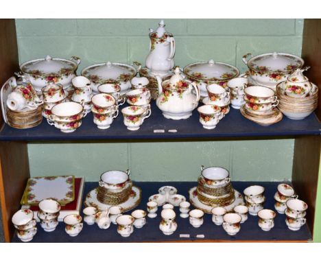 A Royal Albert Old Country Roses pattern tea service on two shelves