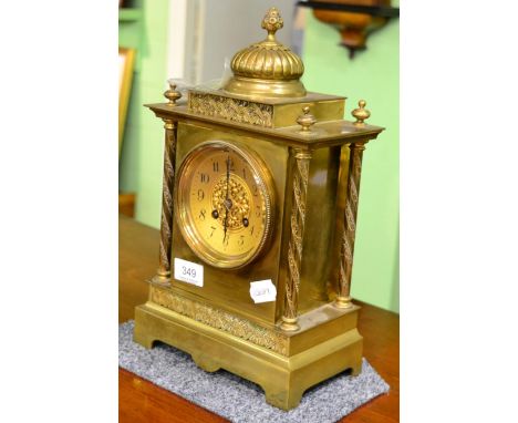 A late 19th century brass mantel clock
