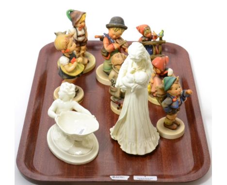 Seven Goebel figures and two Royal Worcester figures
