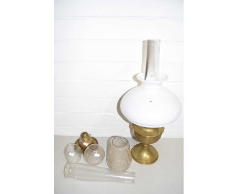 Brass based oil lamp together with a further small brass oil lamp and assorted glass shade