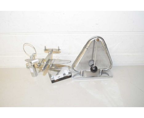 Mixed Lot: Comprising a chrome finish model of a aeroplane, a metal triangle with beater and a gravity supported model of a d