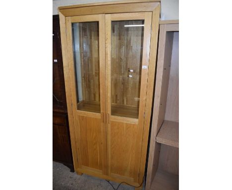 Modern light oak glazed display cabinet with cupboard base