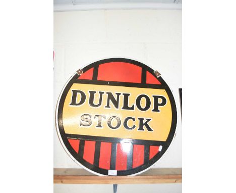 Circular double sided enamel sign marked Dunlop Stock, 61 cm diameter