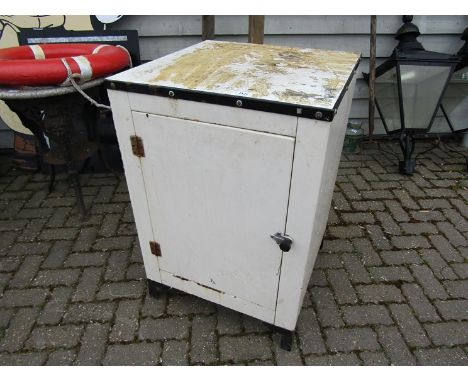 An enamel top metal cabinet