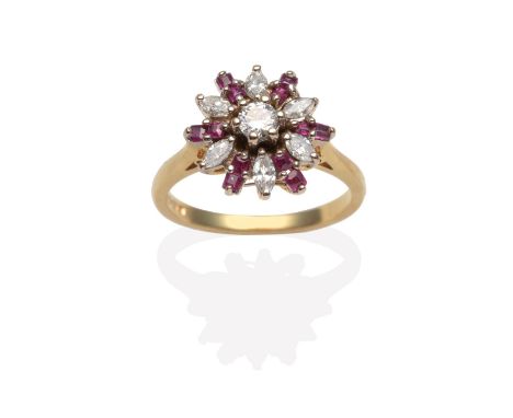 An 18 Carat Gold Ruby and Diamond Cluster Ring, a round brilliant cut diamond within a border of marquise cut diamonds and sq