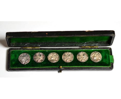 A Set of Five Edwardian Silver Buttons, Cornelius Saunders & Francis Shepherd, Birmingham 1902, repousse with a bust; and A M