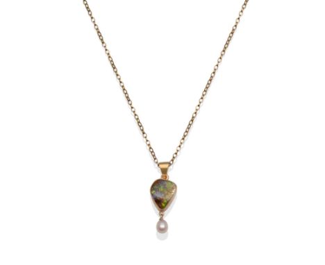 A Black Opal and Cultured Pearl Pendant, a rough black opal in a yellow milgrain setting, suspending a cultured pearl drop, o