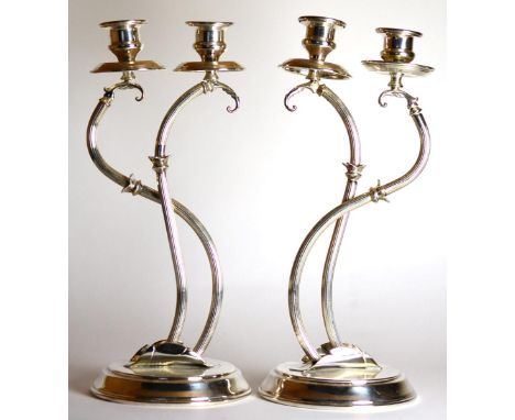 A Pair of Italian Silver Two-Light Candelabra, Florence, post 1968, with urn sconces on fluted scrolling stems and circular b