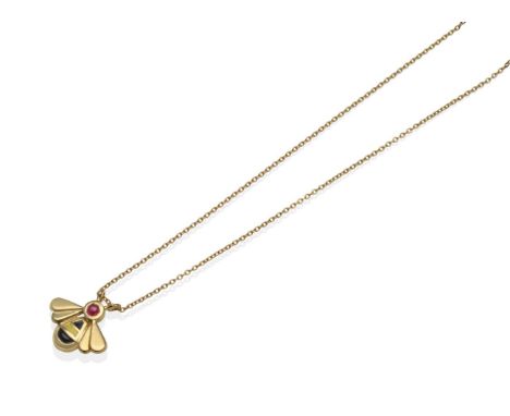 An 18 Carat Gold Ruby and Enamel Bee Pendant, set with a round cabochon ruby and with a black and yellow enamel body, on an 1