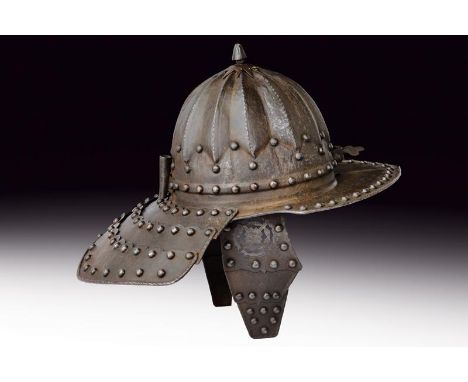 dating: 19th Century provenance: Germany, Hemispherical iron skull with embossed grooves, at the top button with ray -like ba
