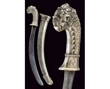 dating: Late 19th Century provenance: Giava, Flat, curved, single-edged blade. Silver grip finely carved and embossed with fl