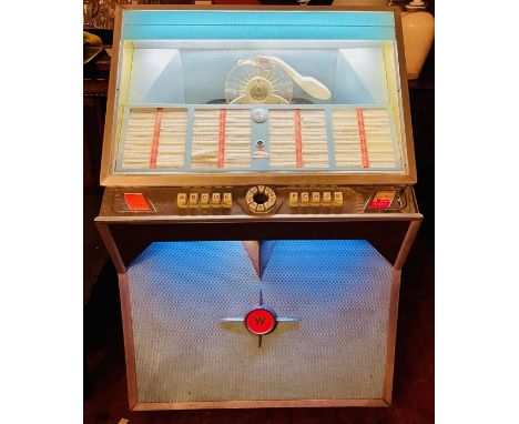 A  Wurlitzer Jukebox Possibly Circa 1970's , type: Lyric, Model number 3084860 contains up to 56 singles featuring The Beatle