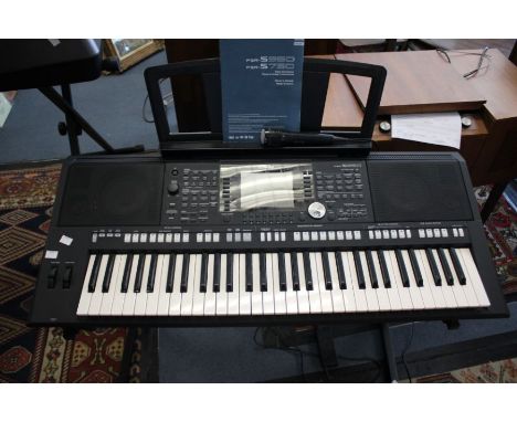 A Yamaha PSR-S950 with stand and instruction manual + Microphone&nbsp;