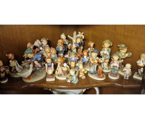 Shelf of Various Goebel/Hummel Figures