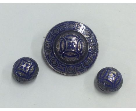 A pair of Scottish silver and enamel buttons together with a matching brooch. Approx. 17.7 grams. Est. £25 - £35.