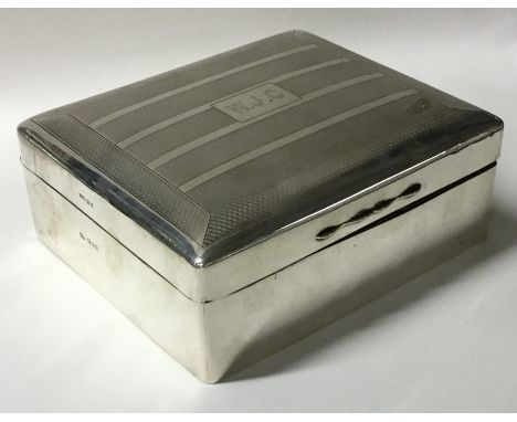 A large engine turned dome top cigarette box with fitted interior. London. By RP. Est. £70 - £80.