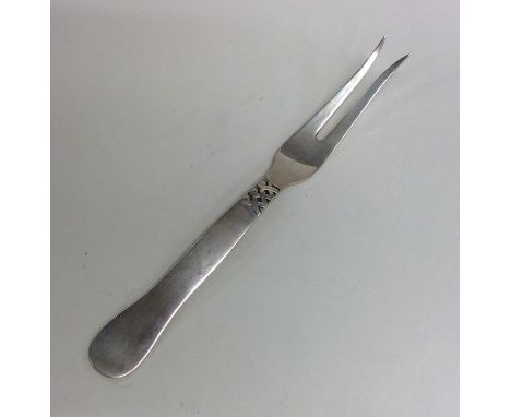 GEORG JENSEN: A stylish silver bread fork of typical form. Approx. 64 grams. Est. £40 - £60.