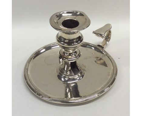 A Georgian silver chamber stick with reeded border. London 1832. Approx. 225 grams. Est. £200 - £250.