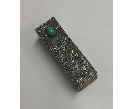 A rectangular white metal travelling compact decorated with scrolls. Approx. 40 grams. Est. £20 - £30.