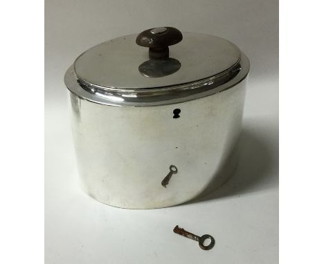 A plain oval Georgian silver tea caddy with flush fitting lid. London 1800. By AK. Approx. 397 grams. Est. £800 - £1200.
