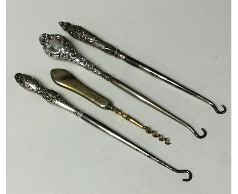 A bag containing embossed silver button hooks. Approx. 95 grams. Est. £15 - £20.