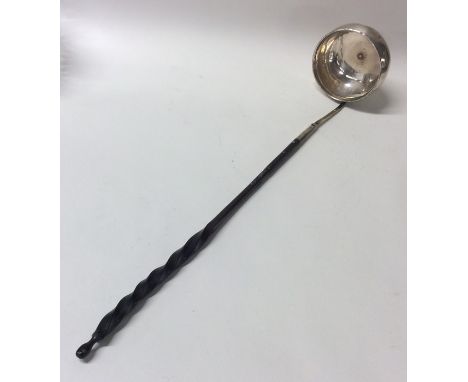A Georgian silver toddy ladle with whalebone handle. Approx. 40 grams. Est. £15 - £20.