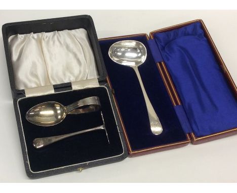 A boxed child's silver pusher and spoon together with a ladle. Birmingham. Approx. 67 grams. Est. £30 - £50.