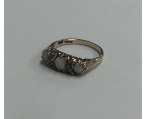 An opal and diamond seven stone ring in 9 carat band. Approx. 2.3 grams. Est. £50 - £80.