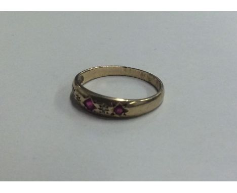 A ruby and diamond gypsy set ring. Approx. 1.6 grams. Est. £40 - £60.