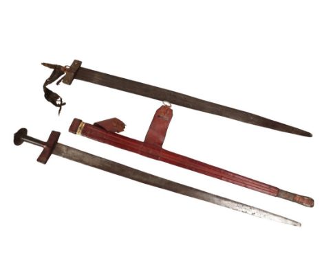 TWO TULWAR STYLE SWORDS the first in red leather which matches the cross guard, the handle being darker leather, blade in goo