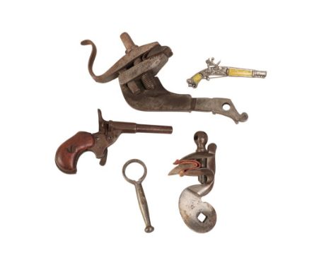 A DEACTIVATED POCKET PISTOL with filled and drilled barrel (deactivated); two flintlock parts and others (a lot)Note: You mus
