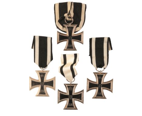 FOUR 1914 IRON CROSSES 2ND CLASSall with three-piece construction, the first with ring stamped with maker mark 'KAG', weight 