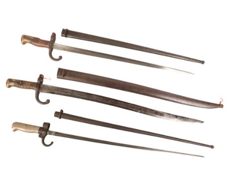 THREE FRENCH BAYONETS including a Chassepot Bayonet with brass handle, average condition; a French Gras Bayonet, scabbard is 