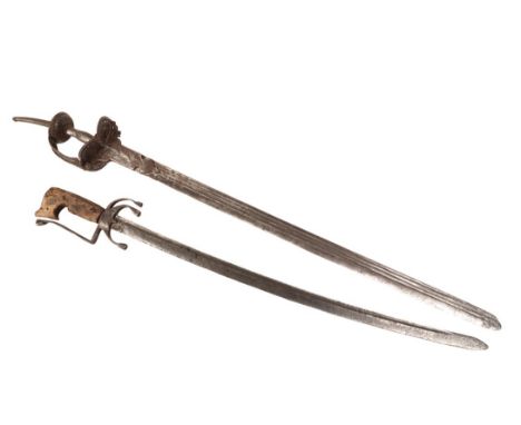 A LATE 19TH CENTURY INDIAN TULWAR SWORD of classic form with a broad blade, iron hilt and disc pommel terminating onto a styl