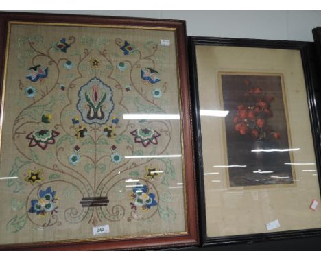 A framed embroidery and floral print