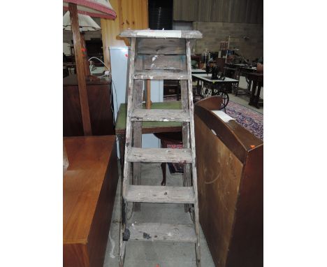 A set of vintage wooden step ladders