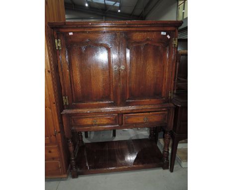 A quality reproduction oak side cabinet/buffet in the Tichmarsh and Goodwin style