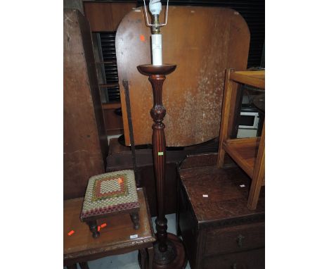 A mahogany effect standard lamp