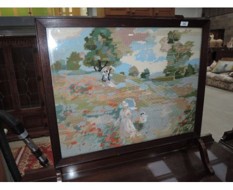 A tapestry fire screen