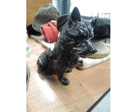 A vintage cast model of a Scottie dog or terrier